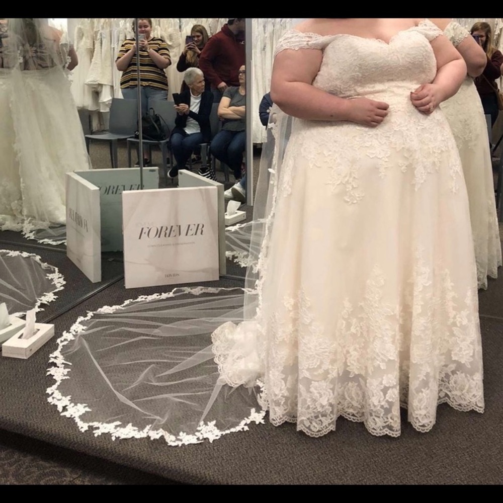 This dress is a size 30,it is a lace and tulle a-line wedding dress.